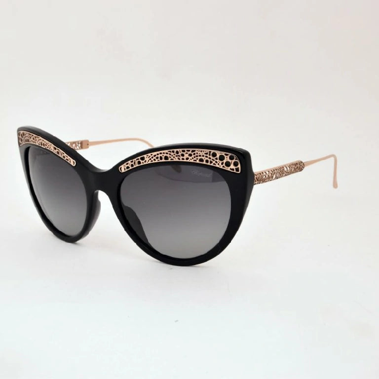 lunette-solaire-chopard-noir-et-dore-pour-femme.webp